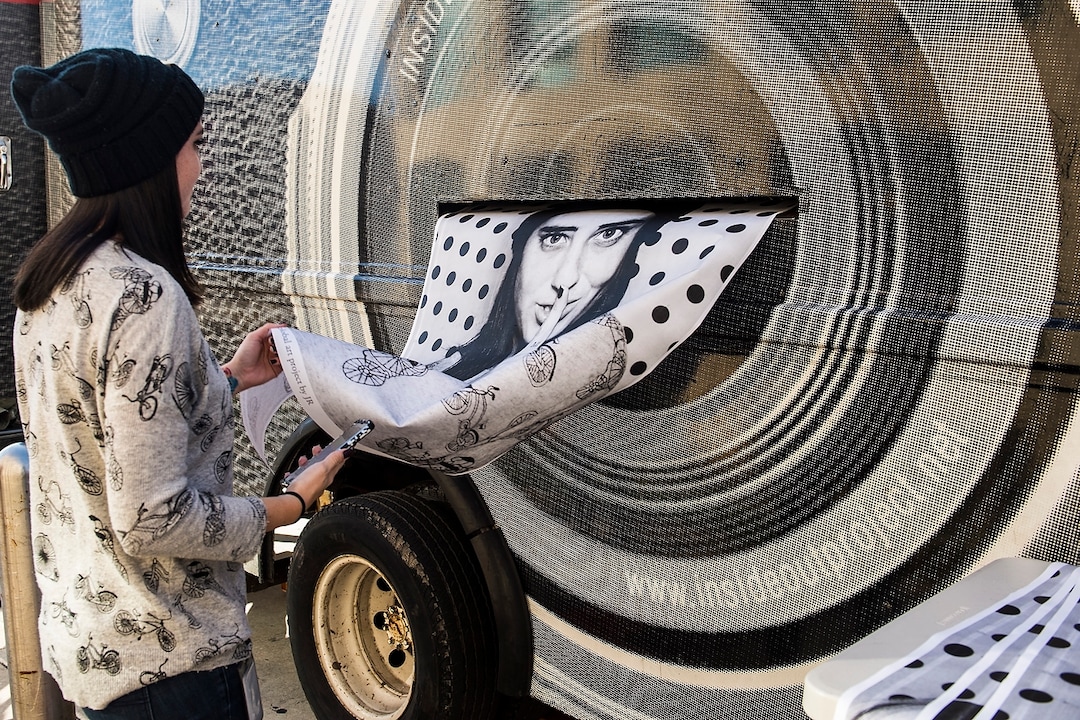 (Chris Detrick  |  The Salt Lake Tribune)  Madison Galt, of Salt Lake City, holds her portrait as it is printed from the photo truck during the Inside Out/Dreamers Project at the Salt Lake City Public Library Tuesday, November 21, 2017.  The Inside Out Project is a global participatory art project that gives everyone the opportunity to share their portrait and express what they stand for. In Utah, the future of more than 10,500 DACA recipients is being threatened by President Trump's decision to end the popular and successful DACA program.