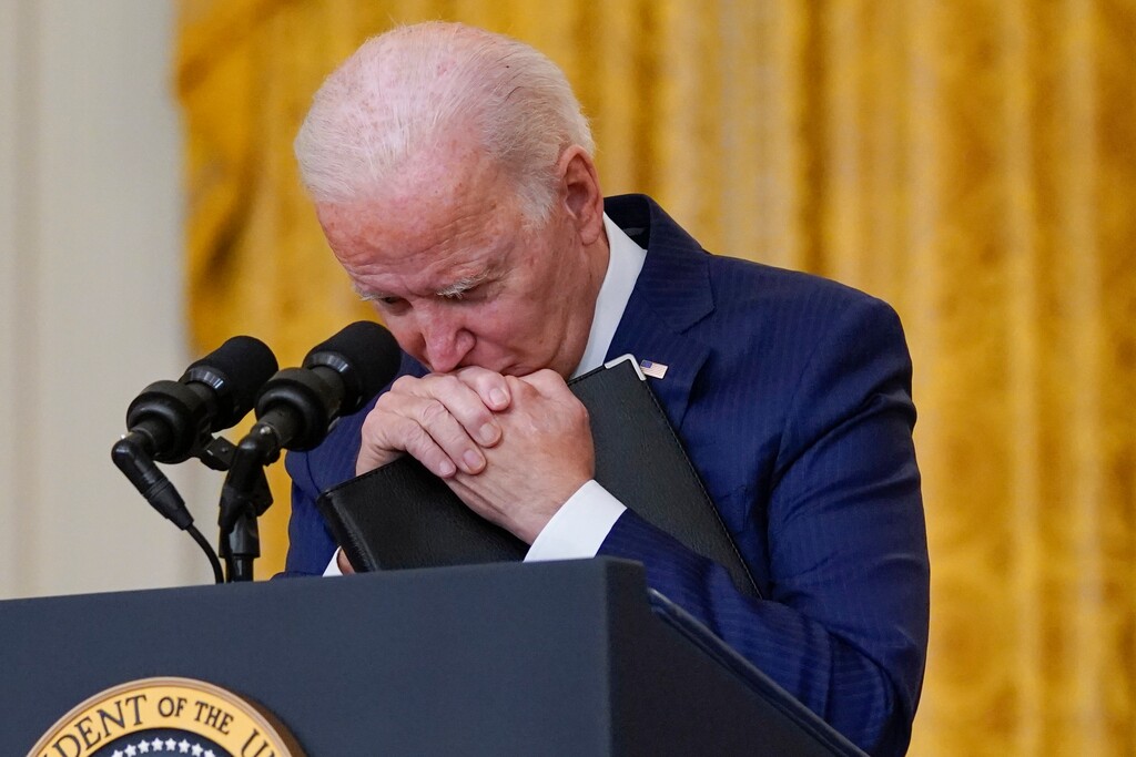 (Evan Vucci | The Associated Press) President Joe Biden pauses as he speaks about the bombings at the Kabul airport that killed at least 12 U.S. service members, from the East Room of the White House, Thursday, Aug. 26, 2021, in Washington.