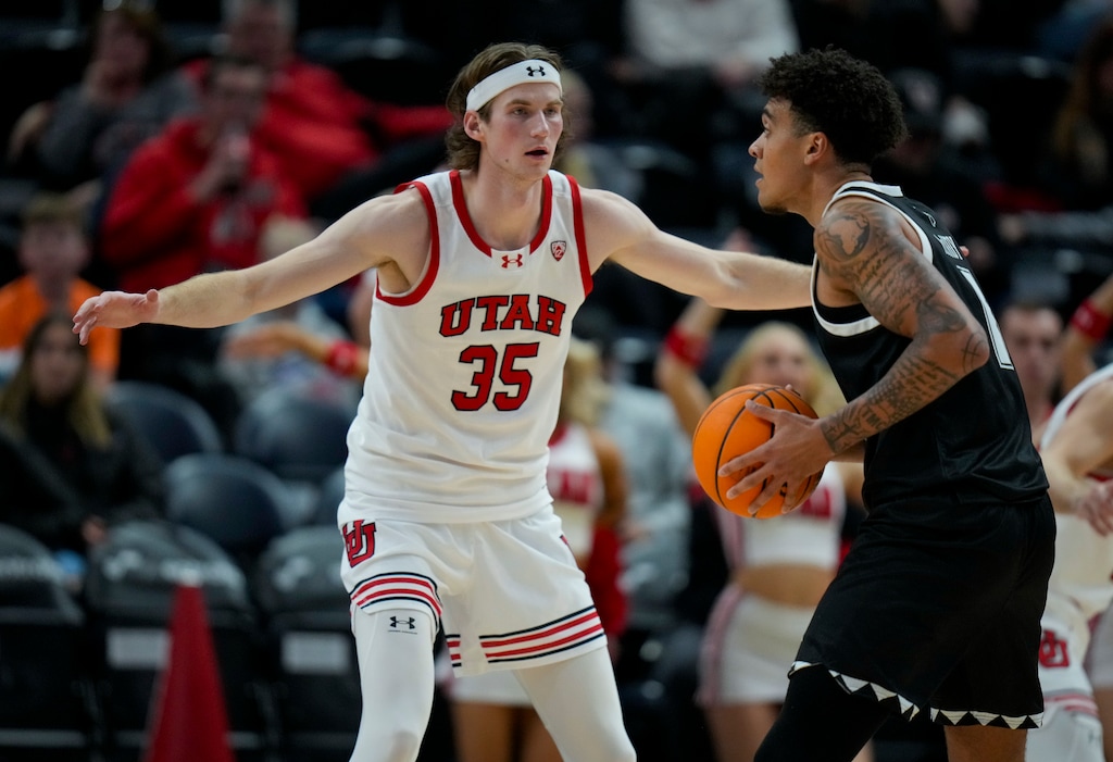 (Bethany Baker  |  The Salt Lake Tribune) Utah Utes center Branden Carlson (35) defends as Hawaii Warriors forward Justin McKoy (1) looks to pass at the Delta Center in Salt Lake City on Thursday, Nov. 30, 2023.
