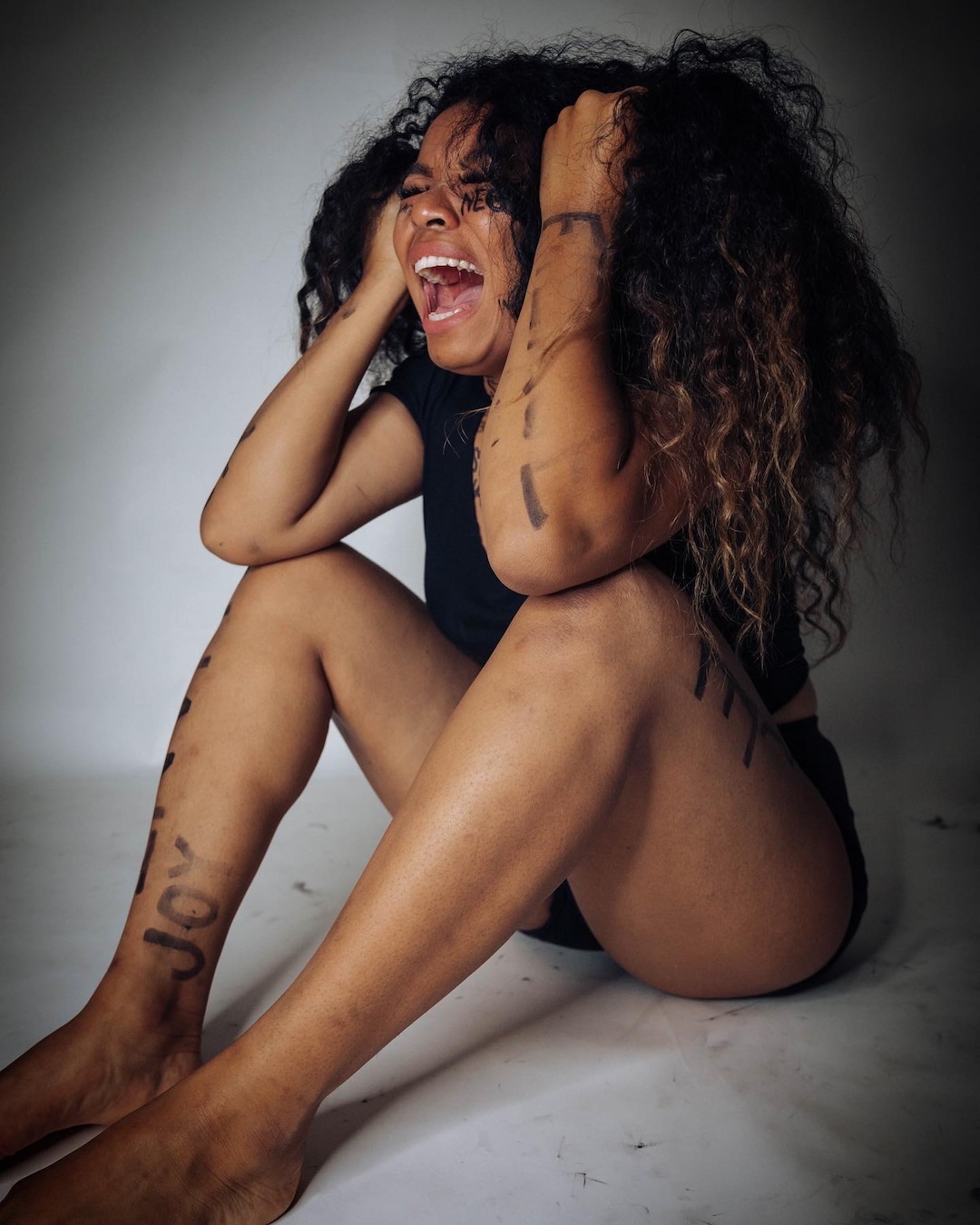 (Photo courtesy of Ana Brown Photo + Film) An emotional photo of Stephanie Nguyen Lake during a photo shoot used to show how black women are portrayed and viewed by society.