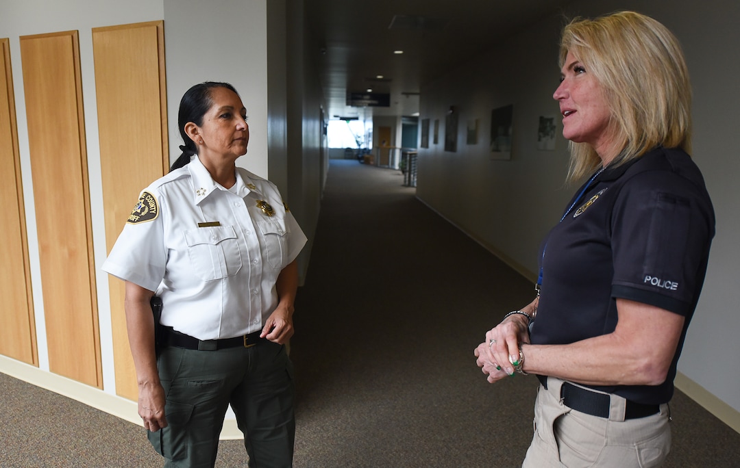 (Francisco Kjolseth  |  The Salt Lake Tribune)  Rosie Rivera, left, the first woman in Utah to serve as any county's sheriff speaks with Sgt. Jodie Sampson at the Salt Lake County Sheriff's Office Building in Salt Lake City on Monday, Dec. 11, 2017. 