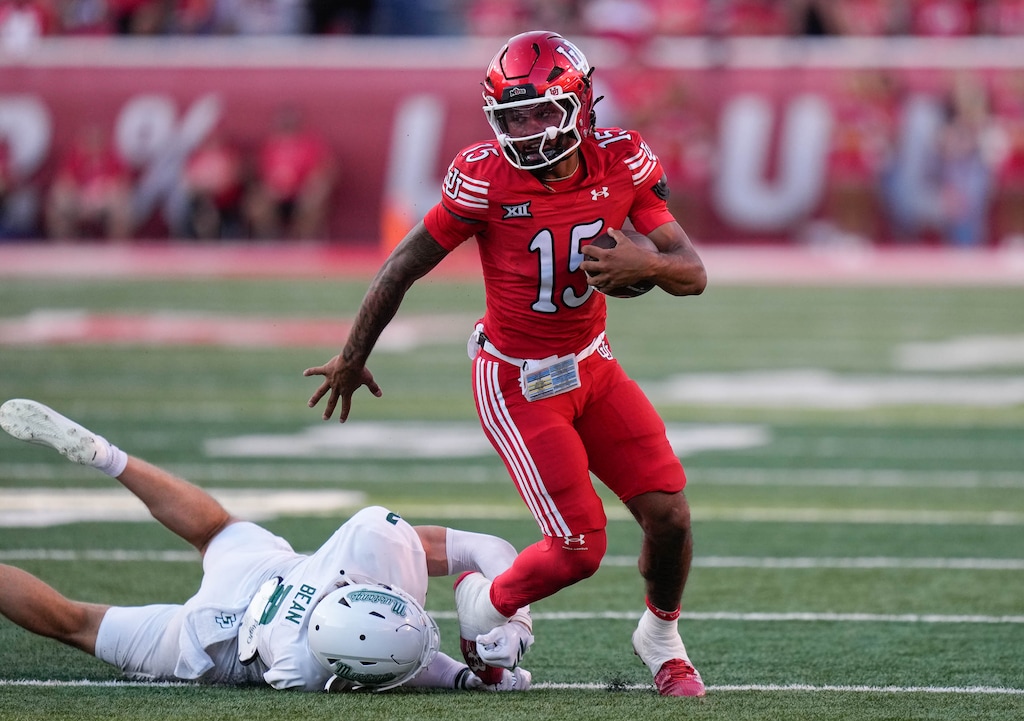 (Francisco Kjolseth | The Salt Lake Tribune) Utah Utes quarterback Byrd Ficklin (15) runs the ball as Utah hosts Cal Poly on Sept. 6.