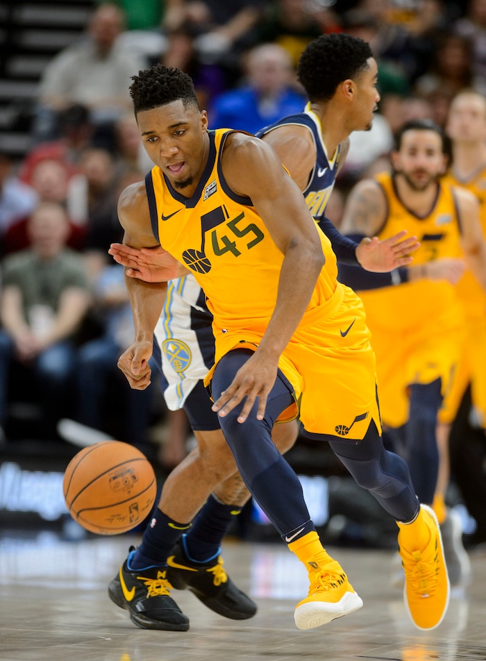 (Steve Griffin  |  The Salt Lake Tribune) Utah Jazz guard Donovan Mitchell (45) steals the ball and heads up court during the Utah Jazz versus Denver Nuggets NBA basketball game at Vivint Smart Home Arena  in Salt Lake City Tuesday November 28, 2017.