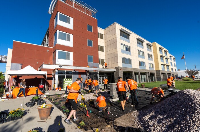(Rick Egan | The Salt Lake Tribune) More than 600 volunteers, led by Home Depot employees, help spruce up the Sunrise Metro and Freedom Landing apartments in Salt Lake City on Wednesday, Sept. 21, 2022.