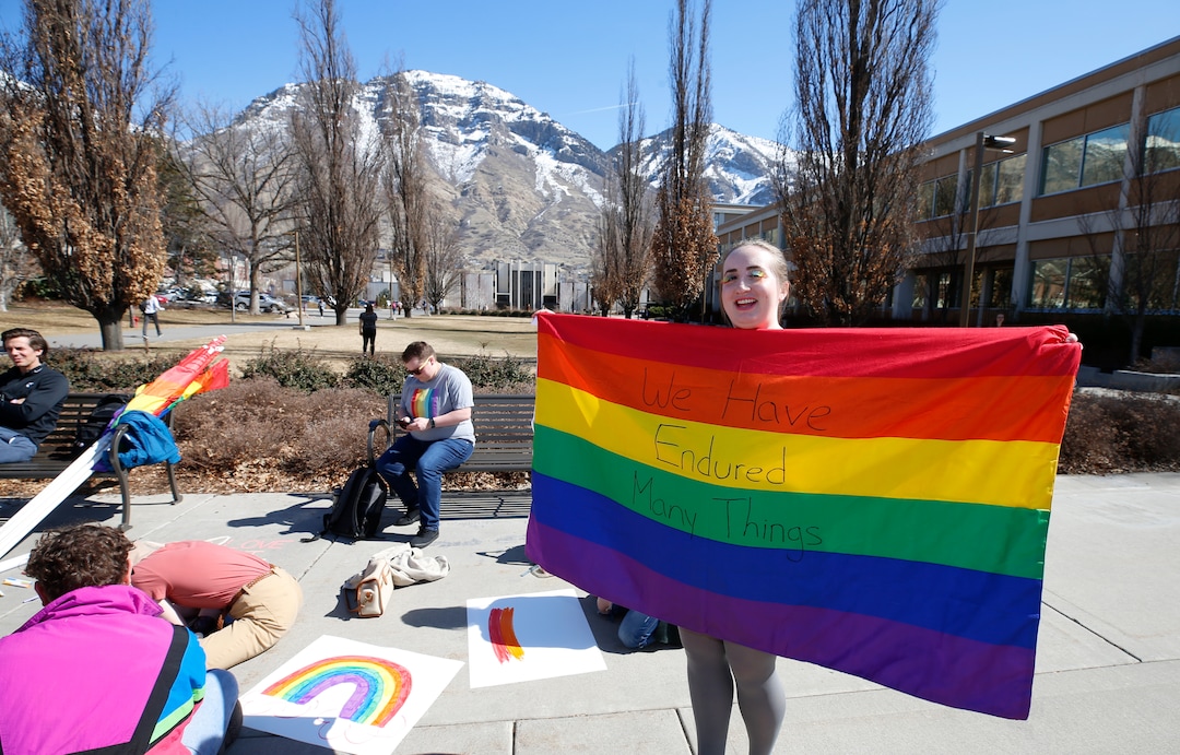(George Frey  |  special to The Salt Lake Tribune) BYU students and others gather in front of the Ernest L. Wilkinson Student Center on the campus of Brigham Young University to protest BYUÕs rollback of a newly announced policy change on LGBTQ students on March 5, 2020 in Provo, Utah.