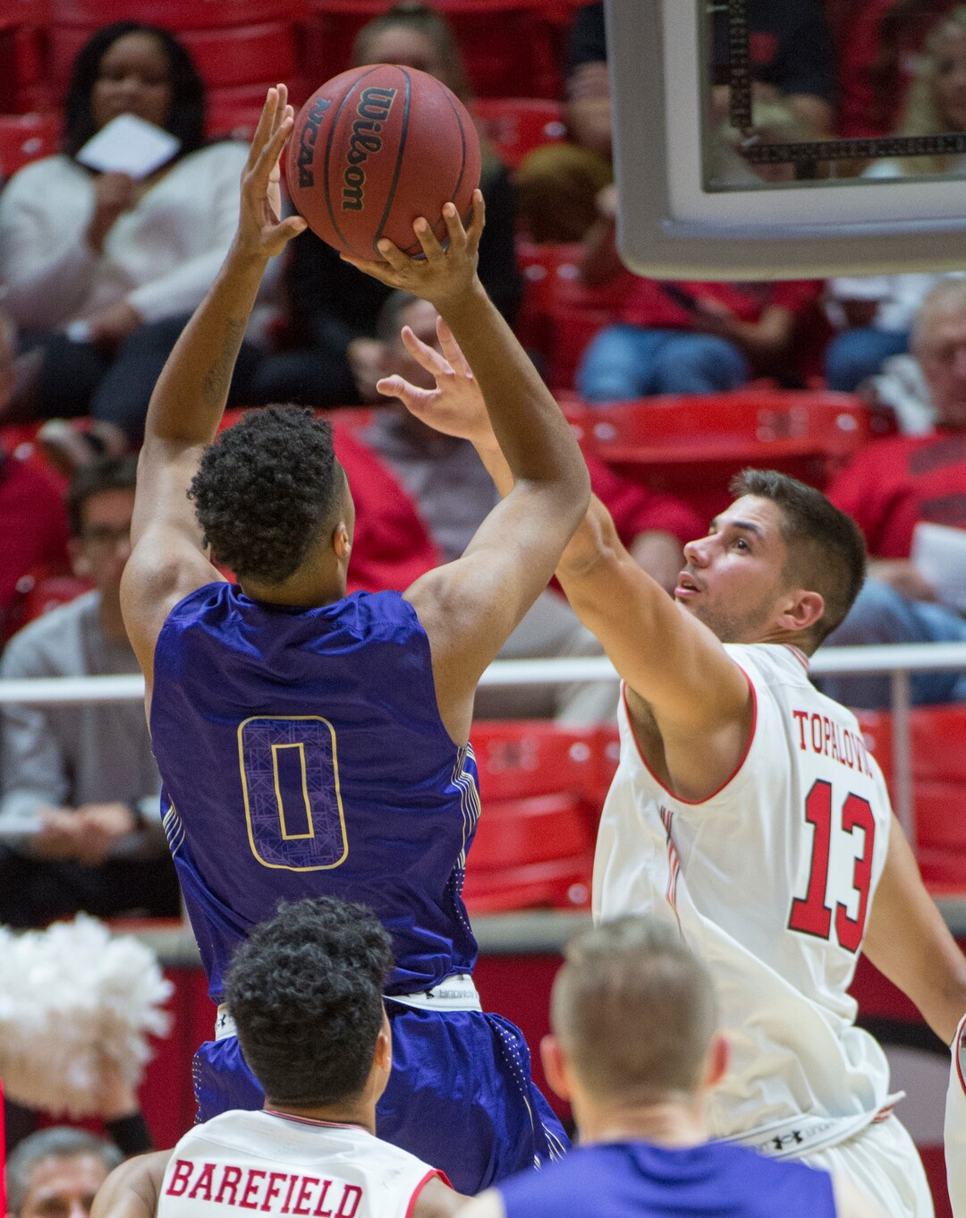 (Rick Egan  |  The Salt Lake Tribune)      Jalen Galloway (0) College of Idaho, shoots, as Utah Utes forward Novak Topalovic (13) defends, in basketball action, between the Utah Utes and the College of Idaho Yotes at the Jon M. Huntsman Center, Thursday, Nov. 1, 2018.