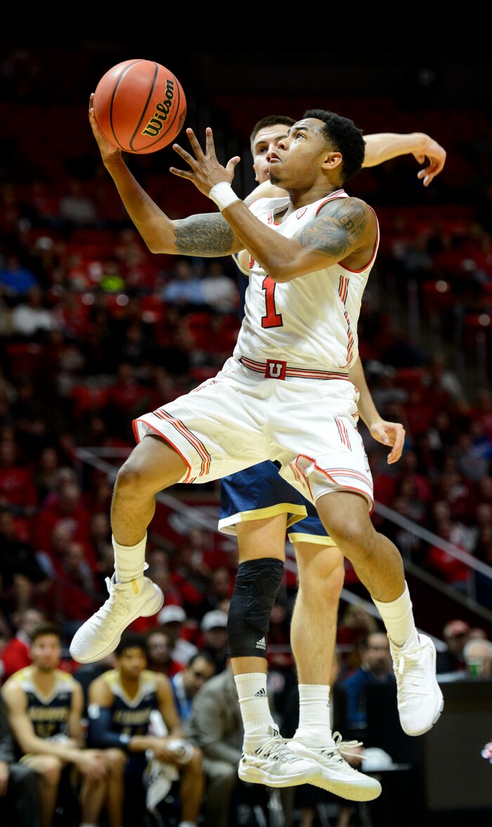 (Steve Griffin  |  The Salt Lake Tribune)  Utah Utes guard Justin Bibbins (1) leaps tot he basket during the Utah versus UC Davis men's NIT basketball game at the Huntsman Center in Salt Lake City Wednesday March 14, 2018.