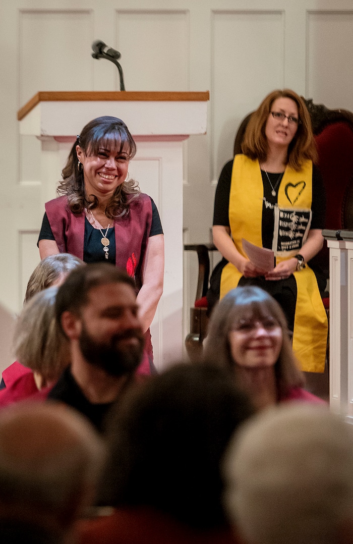 (Michael Mangum  |  Special to the Tribune)

Members of the congregation give Vicky Chavez, center, their well wishes, as Rev. Monica Dobbins, right, listens during a vigil held at First Unitarian Church in Salt Lake City, UT on Wednesday, January 30th, 2019. The vigil marked the one-year anniversary of when Chavez came to the church with her children seeking sanctuary from deportation.