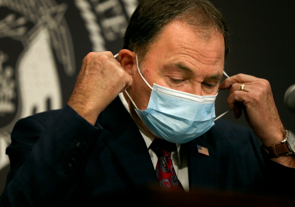 (Laura Seitz | Deseret News, pool) Gov. Gary Herbert removes his mask before speaking at a COVID-19 briefing at the Capitol in Salt Lake City on Thursday, Nov. 12, 2020. 