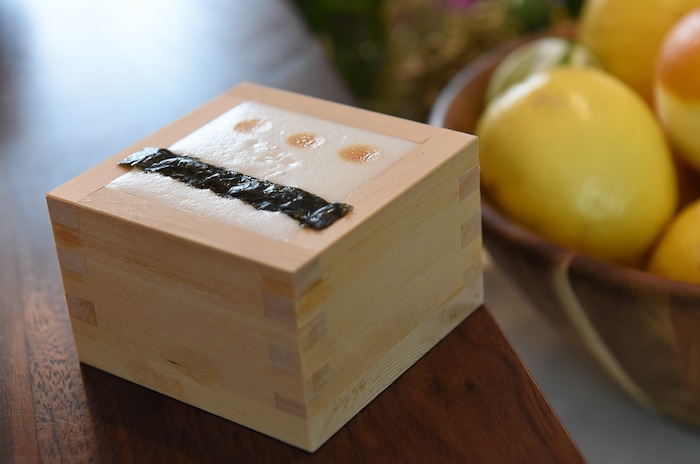 (Francisco Kjolseth  |  The Salt Lake Tribune)  Bartender Crystal Daniels prepares a Nikkei Sour with barsol pisco, ponzu, lime, egg white, chuncho bitters and served inside a cedar box at the Post Office Place, a new bar by the same owners as Takashi, located next door, welcomes patrons on Tuesday, June 19, 2018.