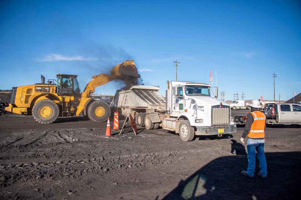 (Byron C. Shorty | Navajo Nation Office of the Speaker via AP) In this Jan. 31, 2020, photo, coal is loaded into trucks at the Navajo Mine to be transported to Navajo communities in the Nenahnezad, N.M.