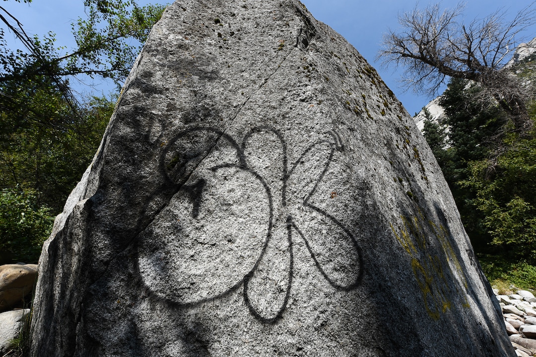 (Francisco Kjolseth  |  The Salt Lake Tribune)  Graffiti has proliferated in lower Little Cottonwood Canyon, where vandals, often wielding cans of fluorescent-colored spray paint, have covered granite faces, trees and structures. The vandalism is particularly apparent along the Temple Quarry Trail and the creek at the Moon Rock swimming hole and former pavilion site. Volunteers using donated equipment and solvents spend thousands of hours removing the paint from the rocks only to see graffiti return to the same faces or on rock nearby.