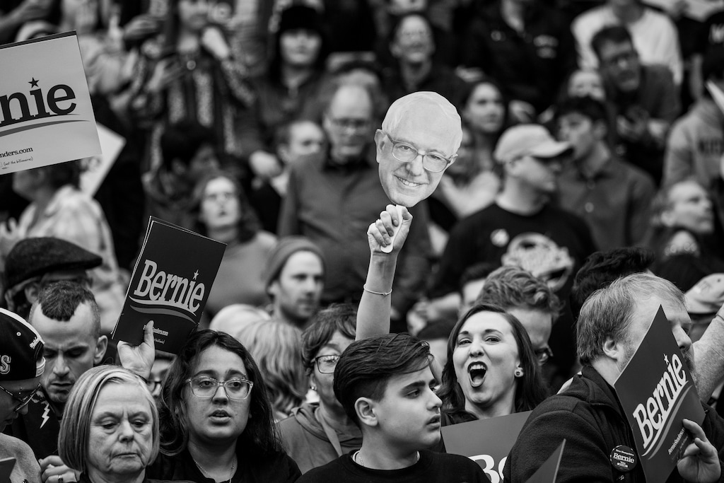 (Damon Winter | The New York Times) Attendees during a rally for Sen. Bernie Sanders (I-Vt.), a candidate for the Democratic presidential nomination, in Manchester, N.H., on Tuesday, Feb. 11, 2020. "As with Donald Trump in 2016, so with Bernie Sanders so far in 2020. The characters are different, but the same dynamics are in play," writes Ross Douthat.