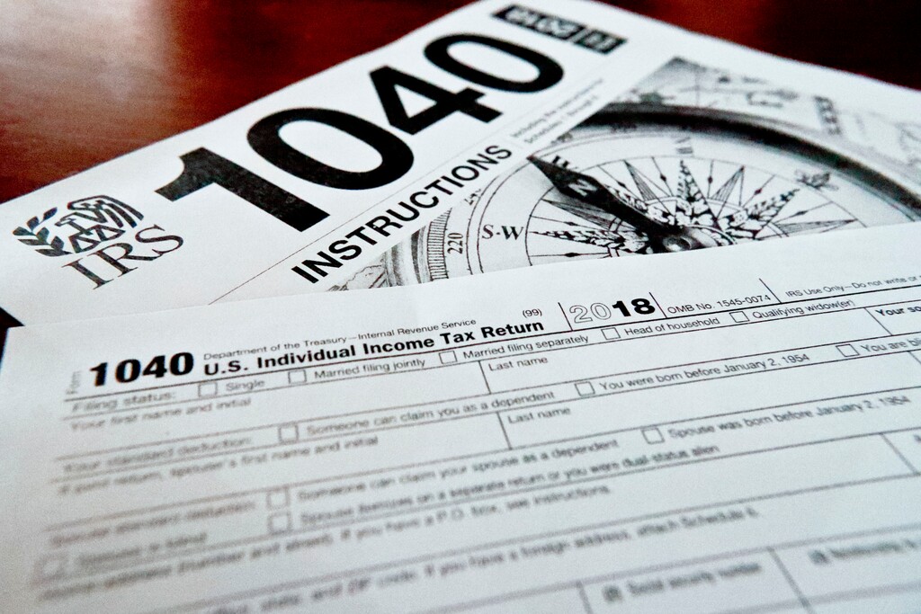 (Keith Srakocic | The Associated Press) This Feb. 13, 2019, file photo shows multiple forms printed from the Internal Revenue Service web page that are used for 2018 U.S. federal tax returns in Zelienople, Pa. If you don’t think you will be able to complete and file your taxes on time, request an extension. Filing an extension helps taxpayers avoid penalties for a late return, according to the IRS.