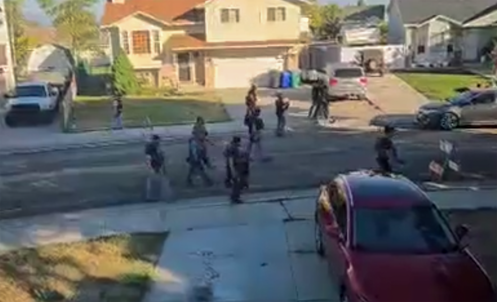 (Ashton R. via Reddit) A video taken and posted by Reddit user Ashton R. shows federal agents walking on a street in West Jordan, Thursday, July 10, 2025.