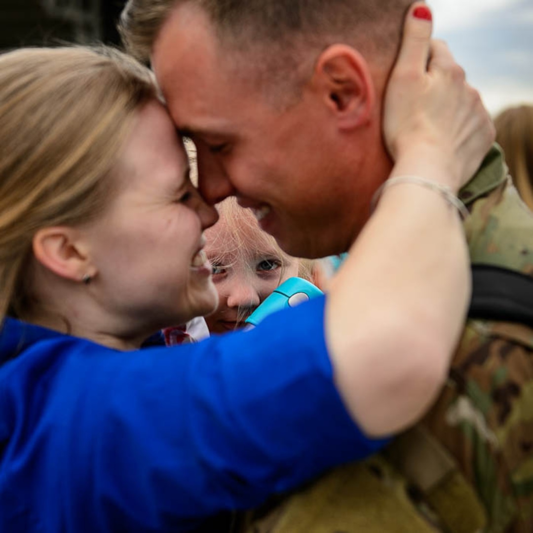 (Trent Nelson  |  The Salt Lake Tribune)  Sergeant Chris Jackson is welcomed home by his wife Kalee and daughter Emma as almost 100 Soldiers from Utah Army National Guard’s Echo Battery, 1st Battalion, 145th Field Artillery, “Big Red” return after a 10-month Middle East deployment, on Tuesday April 9, 2019 at Wright Air Base in Salt Lake City.