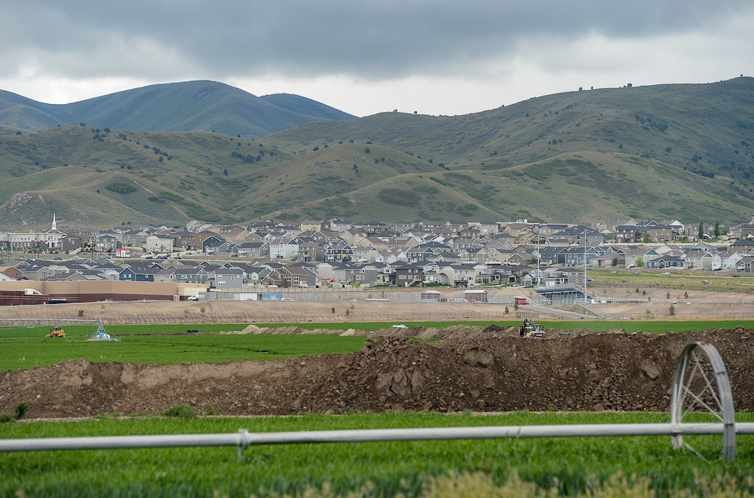 (Francisco Kjolseth  |  The Salt Lake Tribune)  Development continues to creep up against the Oquirrh foothills along the southwest bench in Salt Lake County near Herriman on Friday, May 17, 2019. A flurry of land use planning is underway covering SLCounty's west side, as growth pressure only gets more intense and we head toward a future of wall-to-wall city.