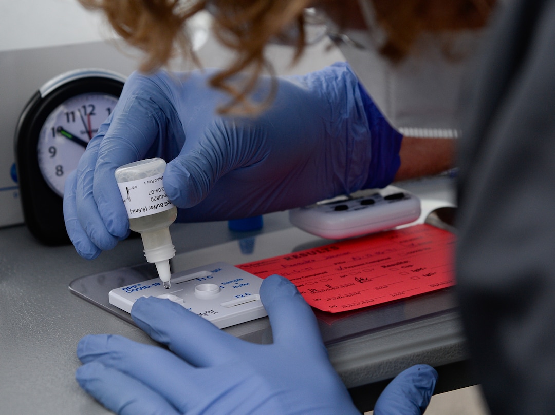 (Francisco Kjolseth  |  The Salt Lake Tribune) Lab tech Bryce Robinette applies a buffer solution as he works the chemistry side of COVID-19 antibody testing for people lined up in their cars at the Galena Hills Park in Draper on Wednesday, May 20, 2020.