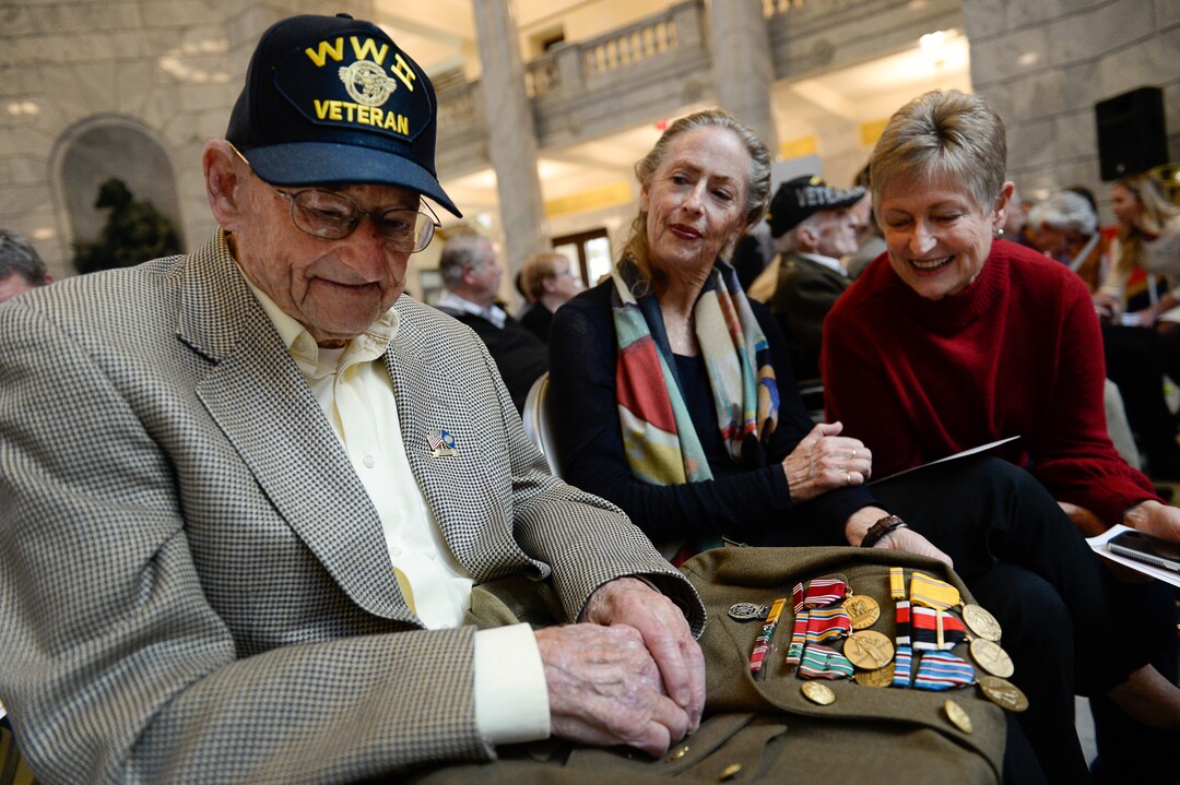 (Francisco Kjolseth  |  The Salt Lake Tribune)  Albert Vise, 100 who was part of the 13th wave on Omaha Beach on D-Day, is joined by his daughters Sharon Parks, center, and Pam Hutchinson as they joins a veterans centenarian celebration honoring over 20 veterans 99 and older in Utah at the State Capitol Rotunda on Tuesday, Nov. 5, 2019.