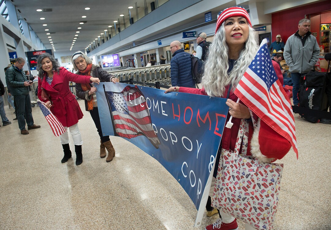 Scott Sommerdorf | The Salt Lake Tribune
Sisters of Corazon Espinosa unfurl a welcome message for her as they wait for her to arrive at the Salt Lake City International Airport, Thursday, March 1, 2018. Espinosa, 70, has been trying to legally immigrate to the U.S. for 40 years. She finally made it to be reunited with her sisters Celeste, left, Carolina, and Teena, right.