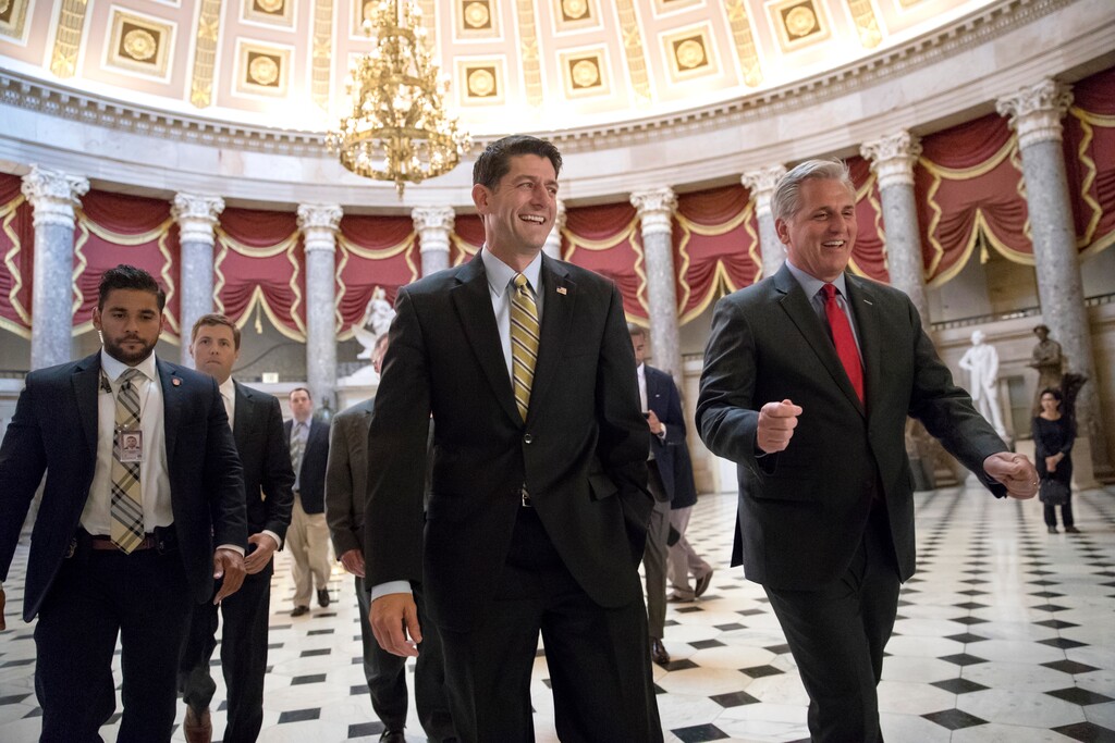 (Scott Applewhite | The Associated Press) Speaker of the House Paul Ryan, R-Wis., center, and Majority Leader Kevin McCarthy, R-Calif., right, walk to the chamber where the House voted overwhelmingly to send a $15.3 billion disaster aid package to President Donald Trump, overcoming conservative objections to linking the emergency legislation to a temporary increase in America's borrowing authority, Friday, Sept 8, 2017 in Washington.
