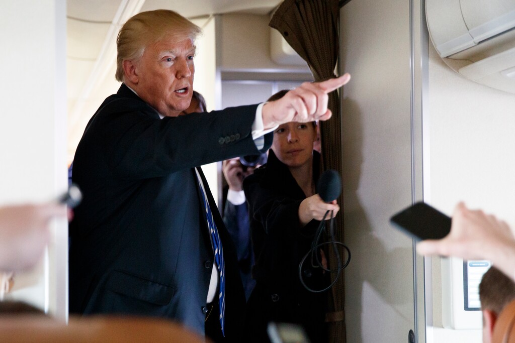 President Donald Trump talks with reporters aboard Air Force One, Thursday, April 5, 2018. (AP Photo/Evan Vucci)