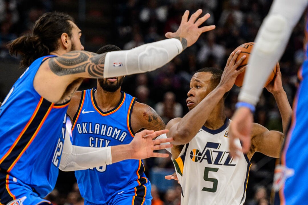 (Trent Nelson | The Salt Lake Tribune)  Utah Jazz guard Rodney Hood (5) defended by Oklahoma City Thunder center Steven Adams (12) as the Utah Jazz host the Oklahoma City Thunder, NBA basketball in Salt Lake City, Saturday December 23, 2017.