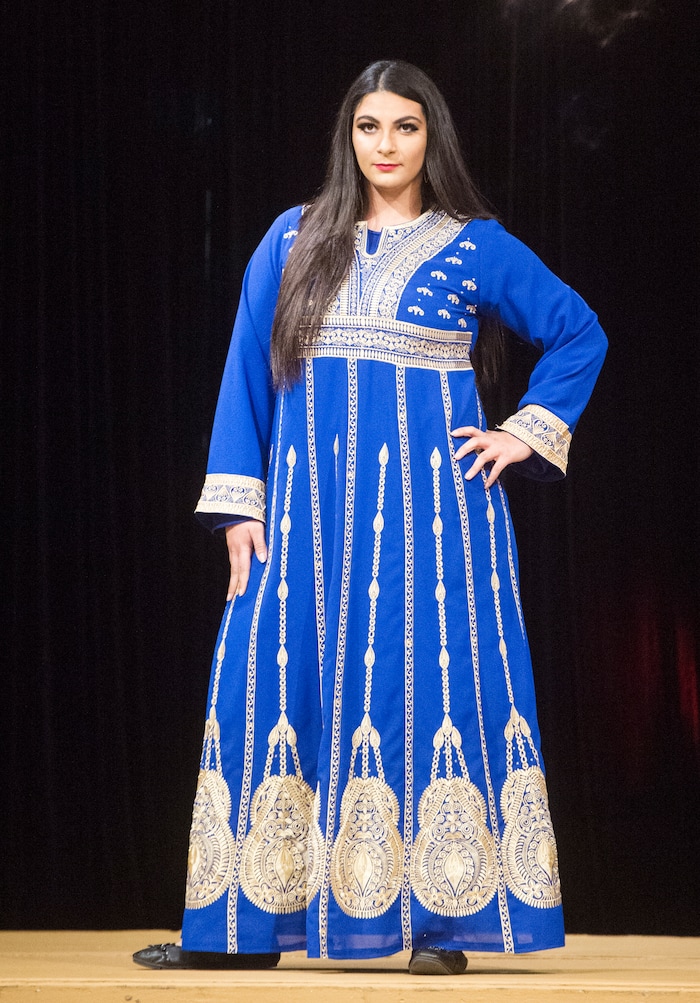(Rick Egan  |  The Salt Lake Tribune)  Noel Farr models an outfit from Egypt,at the 8th Annual Women of the World Fashion Show. The fashion show fund is raiser for the non-profit that seeks to help refugees settle in a new culture. Wednesday, March 7, 2018.