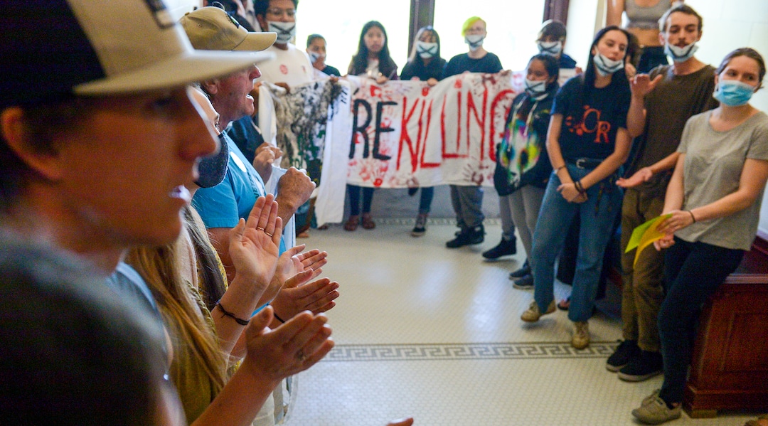 (Leah Hogsten  |  The Salt Lake Tribune) Opponents of the proposed inland port are escorted out of the Utah Inland Port Authority Board meeting by Utah Highway Patrol officers at the Capitol, June 5, 2019. The Inland Port Authority Board had to cancel its meeting last month after a group of protesters took over the meeting.
