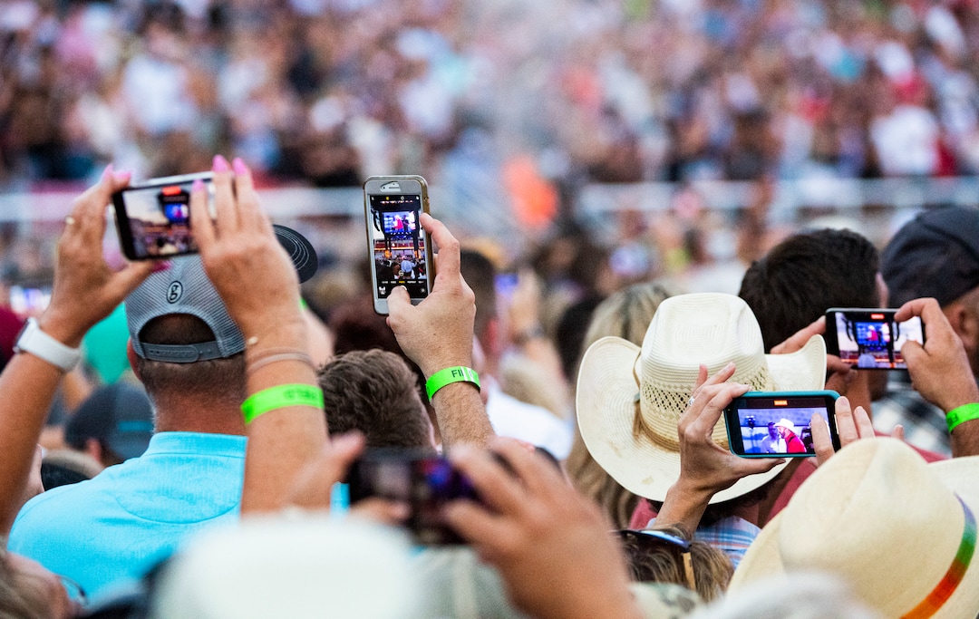 (Isaac Hale | Special to The Tribune) Fans take photos and video as Garth Brooks performs with his band during a stop on their stadium tour held at Rice-Eccles Stadium in Salt Lake City on Saturday, July 17, 2021.