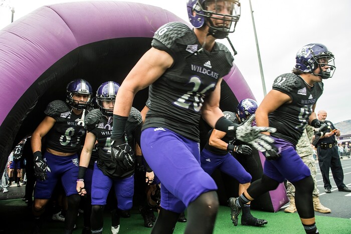 (Chris Detrick  |  The Salt Lake Tribune)  Weber State Wildcats run onto the field before the game at Stewart Stadium Saturday, November 25, 2017.  