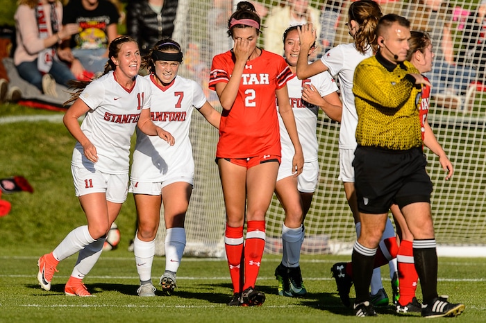 (Trent Nelson | The Salt Lake Tribune) Stanford players celebrate a goal, with Utah's Tavia Leachman (2) at center, as the University of Utah hosts Stanford, NCAA Women's Soccer in Salt Lake City Thursday October 5, 2017.