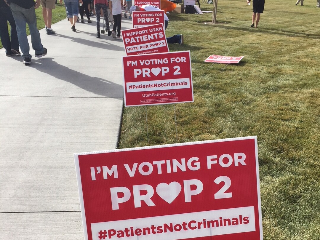 (The Salt Lake Tribune | Kathy Stephenson) Utahns who support Proposition 2 picked up their lawn signs and T-shirt during a rally Saturday.