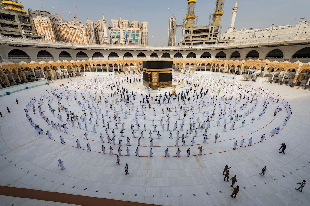 (Saudi Ministry of Media via AP) Pilgrims walk around the Kabba at the Grand Mosque, in the Muslim holy city of Mecca, Saudi Arabia, Friday, July 31, 2020. The global coronavirus pandemic has cast a shadow over every aspect of this year's pilgrimage, which last year drew 2.5 million Muslims from across the world to Mount Arafat, where the Prophet Muhammad delivered his final sermon nearly 1,400 years ago. Only a very limited number of pilgrims were allowed to take part in the hajj amid numerous restrictions to limit the potential spread of the coronavirus.