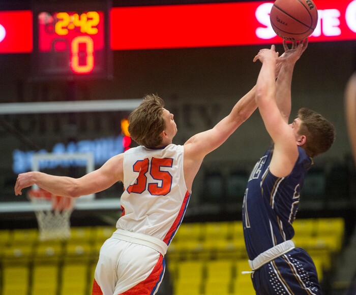 (Rick Egan | The Salt Lake Tribune) Timpview Thunderbirds Matias Meilsoe (35) goes for a pass along with Skyline Eagles Taylor Larsen (21), in 5A basketball playoff action between the Timpview Thunderbirds and at the Skyline Eagles, at the UCCU Center in Orem, Monday, Feb. 26, 2018.
