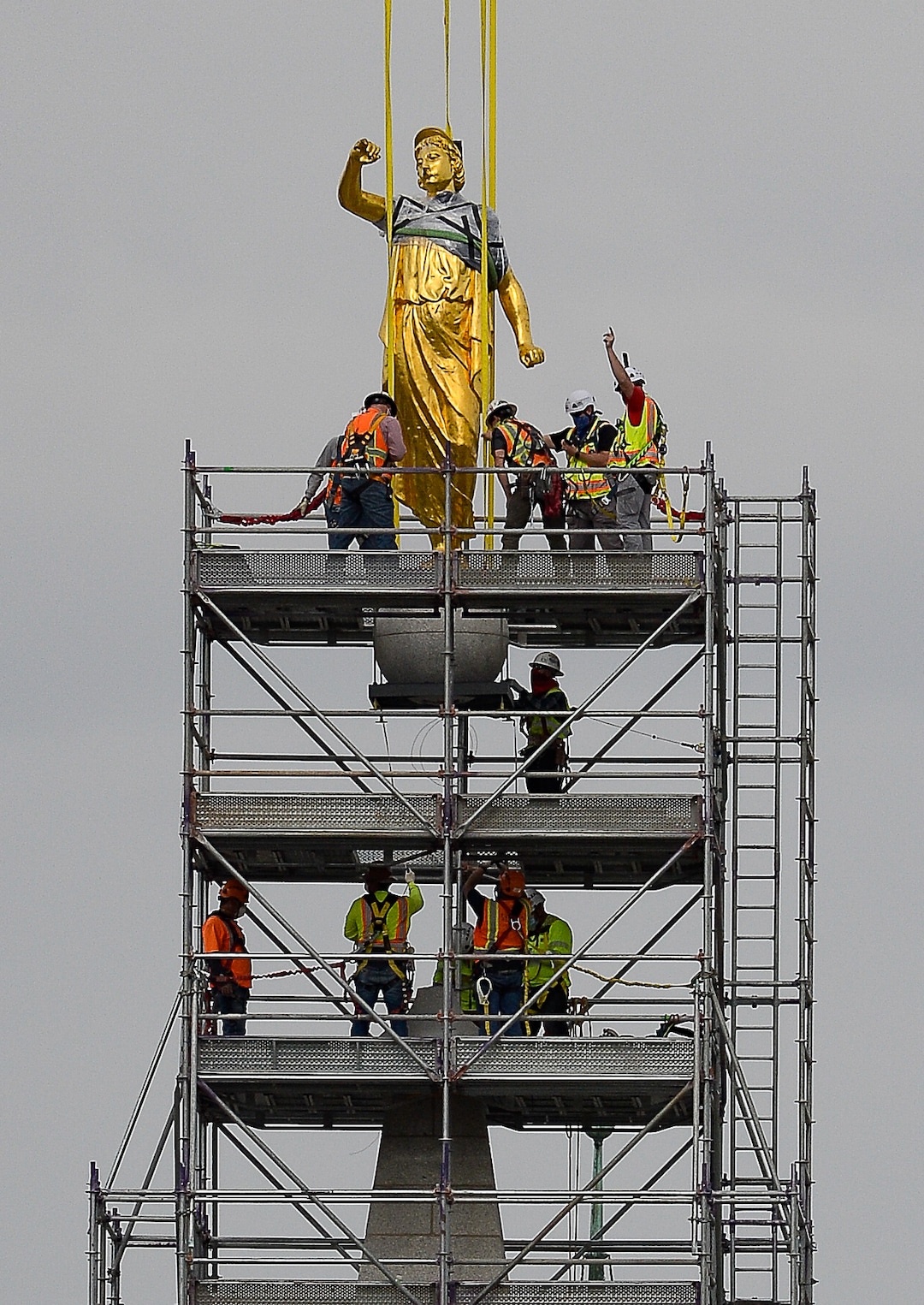 (Francisco Kjolseth  |  The Salt Lake Tribune) Crews work to remove the Angel Moroni statue atop the Salt Lake Temple of The Church of Jesus Christ of Latter-day Saints on Monday, May 18, 2020. The temple closed in December for seismic upgrades and sustained minor damager during the March 18, 2020, magnitude 5.7 earthquake when the trumpet held by the angel fell off and several smaller spire stones were displaced.