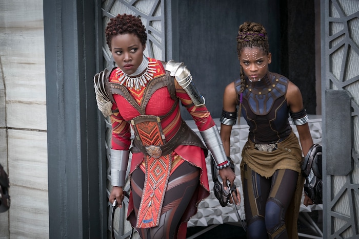 This image released by Disney shows Lupita Nyong'o, left, and Letitia Wright in a scene from Marvel Studios' "Black Panther." (Matt Kennedy/Marvel Studios-Disney via AP)