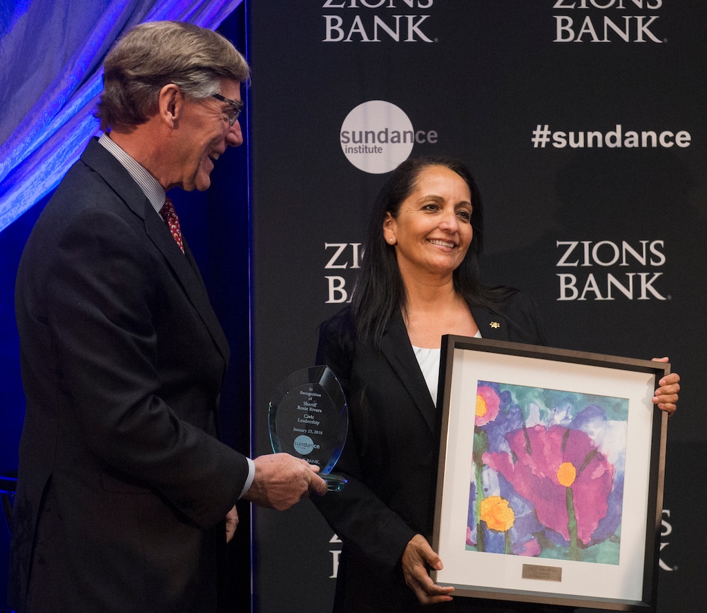 (Rick Egan  |  The Salt Lake Tribune)     Salt Lake County Sheriff Rosie Rivera receives a leadership award from Scott Anderson, President and CEO of Zions Bank, at the 2018 Sundance Film Festival Utah Women’s Leadership Celebration in Park City Jan. 25, 2018.