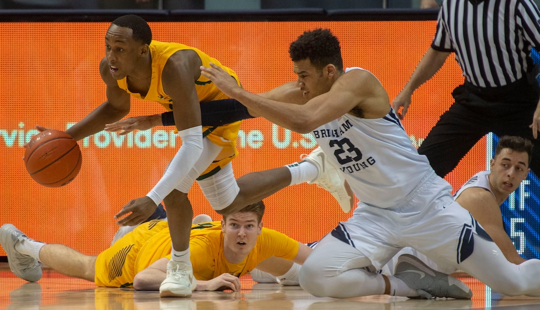 (Rick Egan  |  The Salt Lake Tribune)  Brigham Young Cougars forward Yoeli Childs (23) goes for a loose ball along with San Francisco Dons guard Jamaree Bouyea (1), in WCC basketball action at the Marriott Center, Thursday, February 21, 2018.