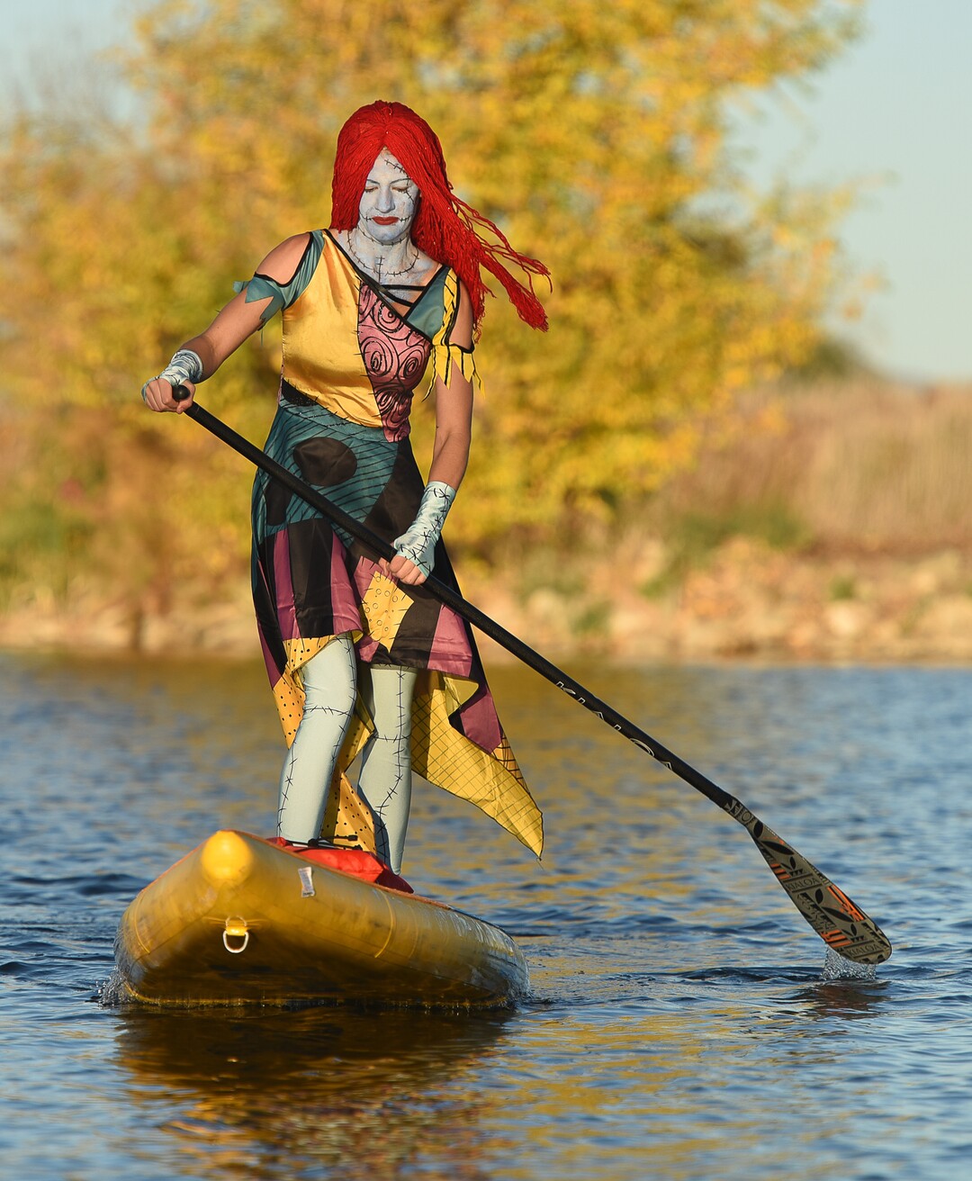 (Francisco Kjolseth  |  The Salt Lake Tribune)  Stand up paddle board enthusiasts Roxy Christensen and Chris Knoles, not pictured, take to the water at Bountiful Pond on Tuesday, Oct. 30, 2018, in what has become a Halloween tradition for the 4th year in a row as they dress up this year as Jack and Sally Skellington from the movie Nightmare Before Christmas. "We paddle year round but actually paddle more in the winter," exclaimed Knoles, who carry the tradition on at Christmas, dressing up in something festive and paddling on the Great Salt Lake where the high salinity usually keeps the water from freezing.