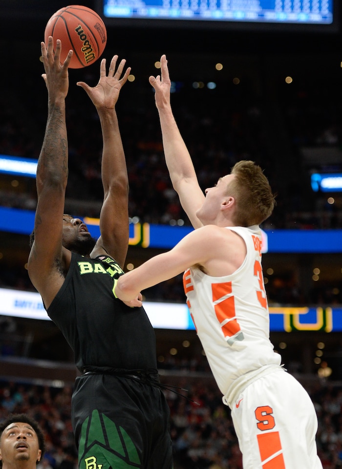 (Francisco Kjolseth  |  The Salt Lake Tribune)  Baylor Bears guard Mario Kegler (4) battles for possession against Syracuse Orange guard Buddy Boeheim (35) as Syracuse faces Baylor in their first round menÕs NCAA March Madness tournament game at Vivint Smart Home Arena in Salt Lake City on Thursday, March 21, 2019.