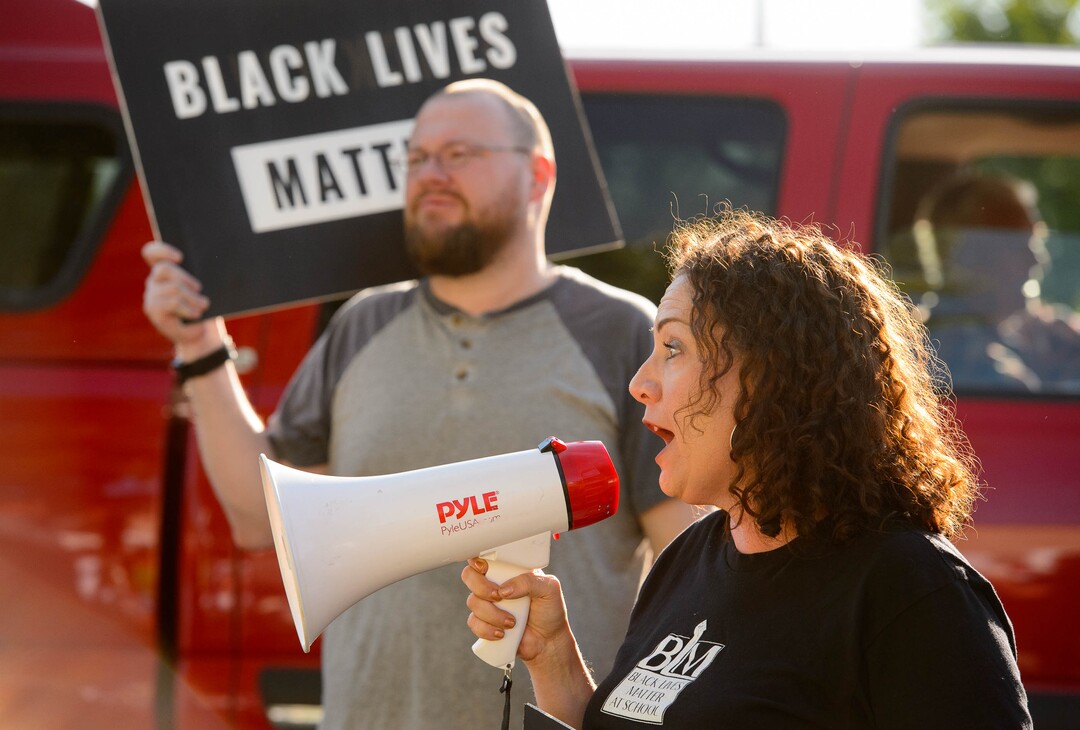 (Trent Nelson  |  The Salt Lake Tribune)Chelsie Acosta speaks at a protest organized by Black Lives Matter and other groups at the Woods Cross Police Department on Friday June 14, 2019. The rally was to show support for DJ Hrubes, a 10-year-old black child who was held at gunpoint by a police officer last week while playing in his grandmother's front yard.