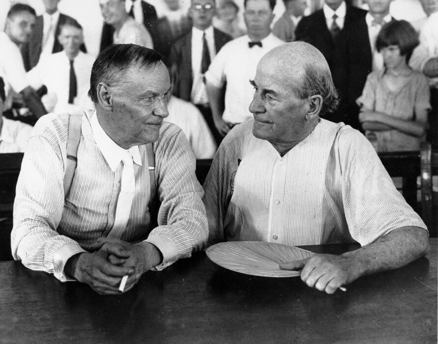 In this July 1925 file photo, Clarence Darrow, left, and William Jennings Bryan speak with each other during the monkey trial in Dayton, Tenn. On Friday, July 13, 2017, at the Rhea County Courthouse in Dayton, the public will behold a 10-foot statue of the rumpled skeptic Darrow, who argued for evolution in the 1925 trial. It will stand at a respectful distance on the opposite side of the courthouse from an equally huge statue of Bryan, the eloquent Christian defender of the biblical account of creation, which was installed in 2005. (AP Photo, File)