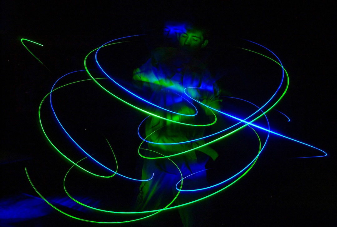 (Trent Nelson | The Salt Lake Tribune) A dancer with glowsticks at a rave at Brick's in Salt Lake City on May 2, 2002.