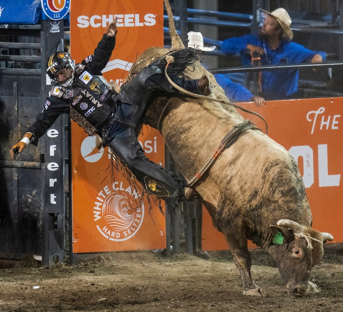 (Rick Egan | The Salt Lake Tribune)  Ednei Caminhas of Brazil competes in the bull riding event at the Utah Days of '47 Rodeo at the State Fairpark, on Monday, July 25, 2022.