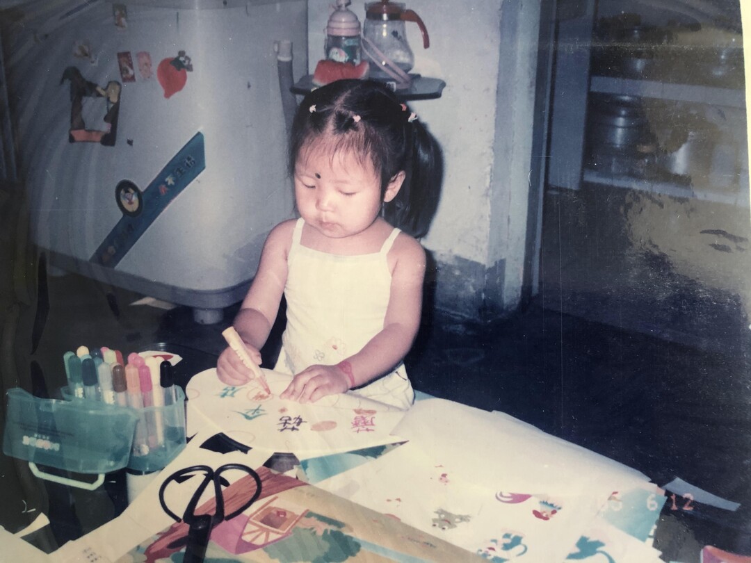 (Dong family) Pictured is Zhifan Dong as a kid, drawing as her parents said she loved to do.