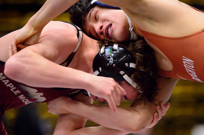 (Trent Nelson | The Salt Lake Tribune)  Brighton's Anthonee Ouk (top) and Maple Mountain's Cole Tierre Patterson, 5A State Championships, high school wrestling quarterfinals in Orem, Wednesday February 7, 2018.