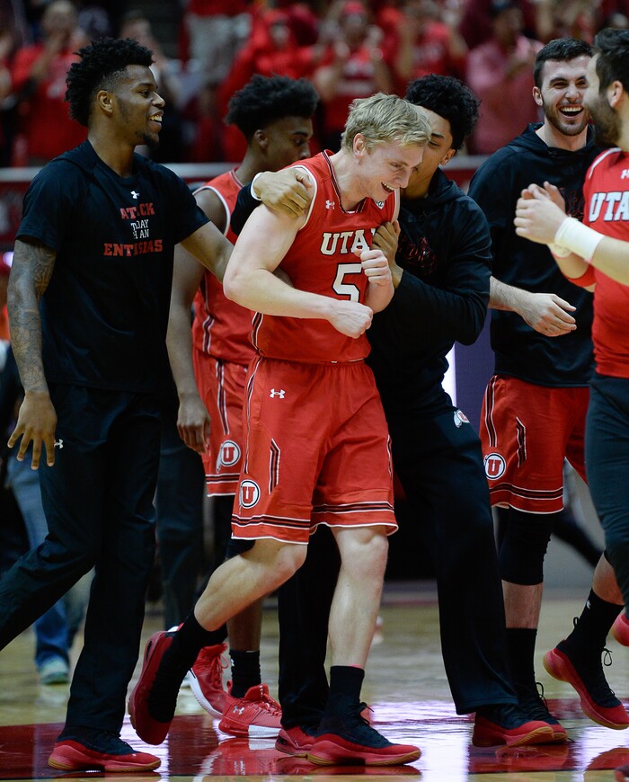 (Francisco Kjolseth  |  The Salt Lake Tribune)  Utah Utes guard Parker Van Dyke (5) is celebrated by his team after playing a critical role in their win over UCLA at the Huntsman Center in Salt Lake City, Thursday, Feb. 22, 2018.