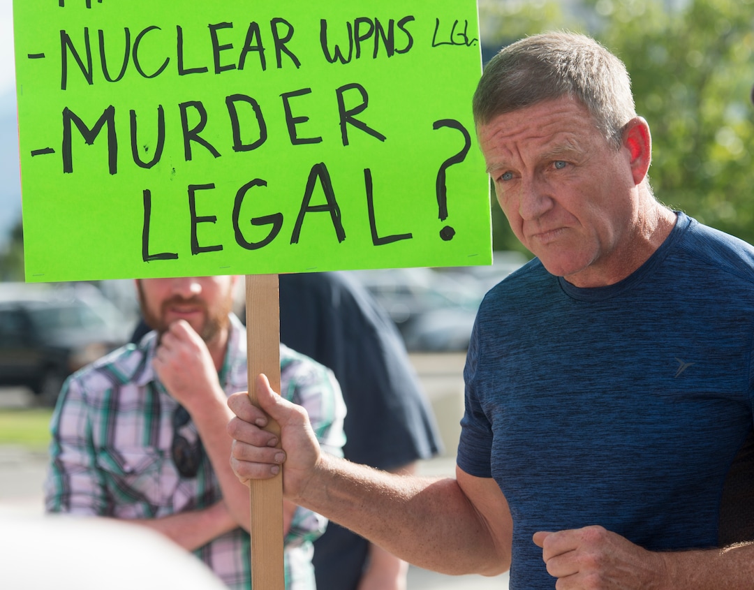 (Rick Egan  |  The Salt Lake Tribune)   Eric Wilson is challenged by 5-6 pro-gun advocates, before a town hall meeting in Sandy, where survivors from the Florida school shooting held a forum with Utah students involved with the March for Our Lives movement, Saturday, July 14, 2018.
