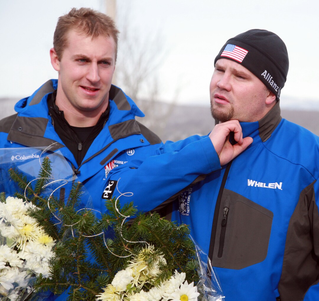 USA Bobsled driver Steven Holcomb checks his pulse as brakeman Curtis Tomasevicz looks on after the team placed third ini the Men's Two-Man Bobsled World Cup race, Saturday, Dec. 15, 2007 in Lake Placid, N.Y.  (AP Photo/Todd Bissonette)